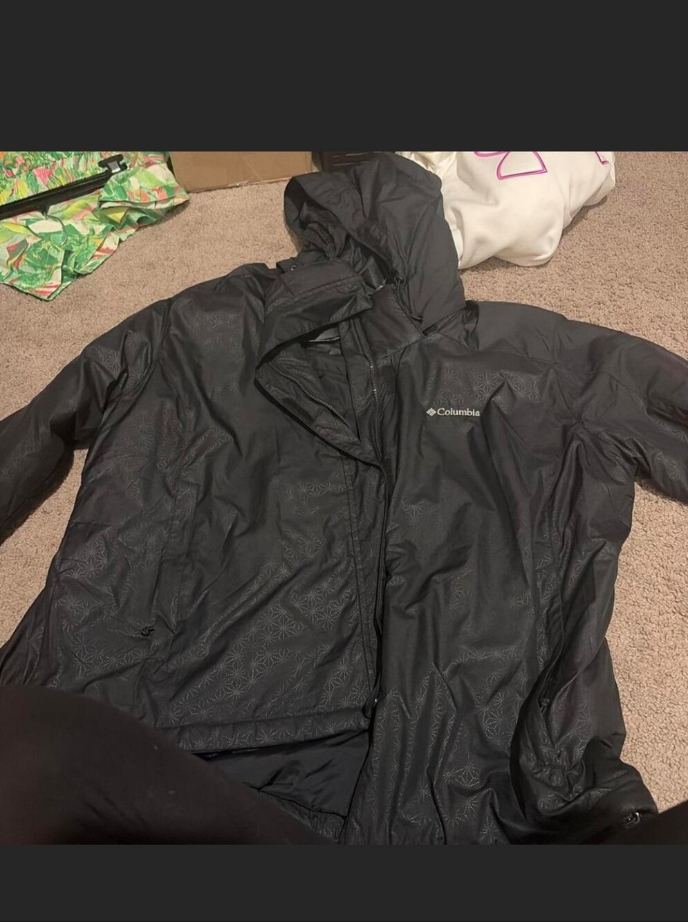 Black Columbia Womens Waterproof Warm Jacket with subtle geometric pattern